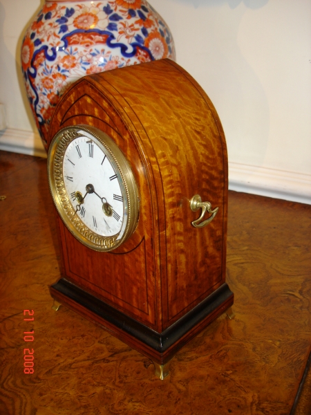 Small Satinwood table clock.