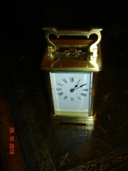 Very small striking carriage Clock.